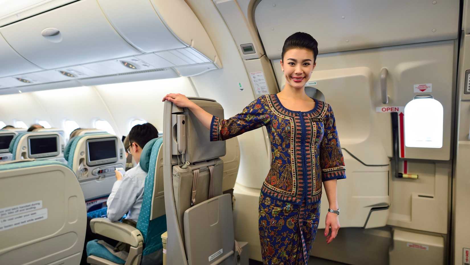 Singapore Airlines cabin crew at exit row