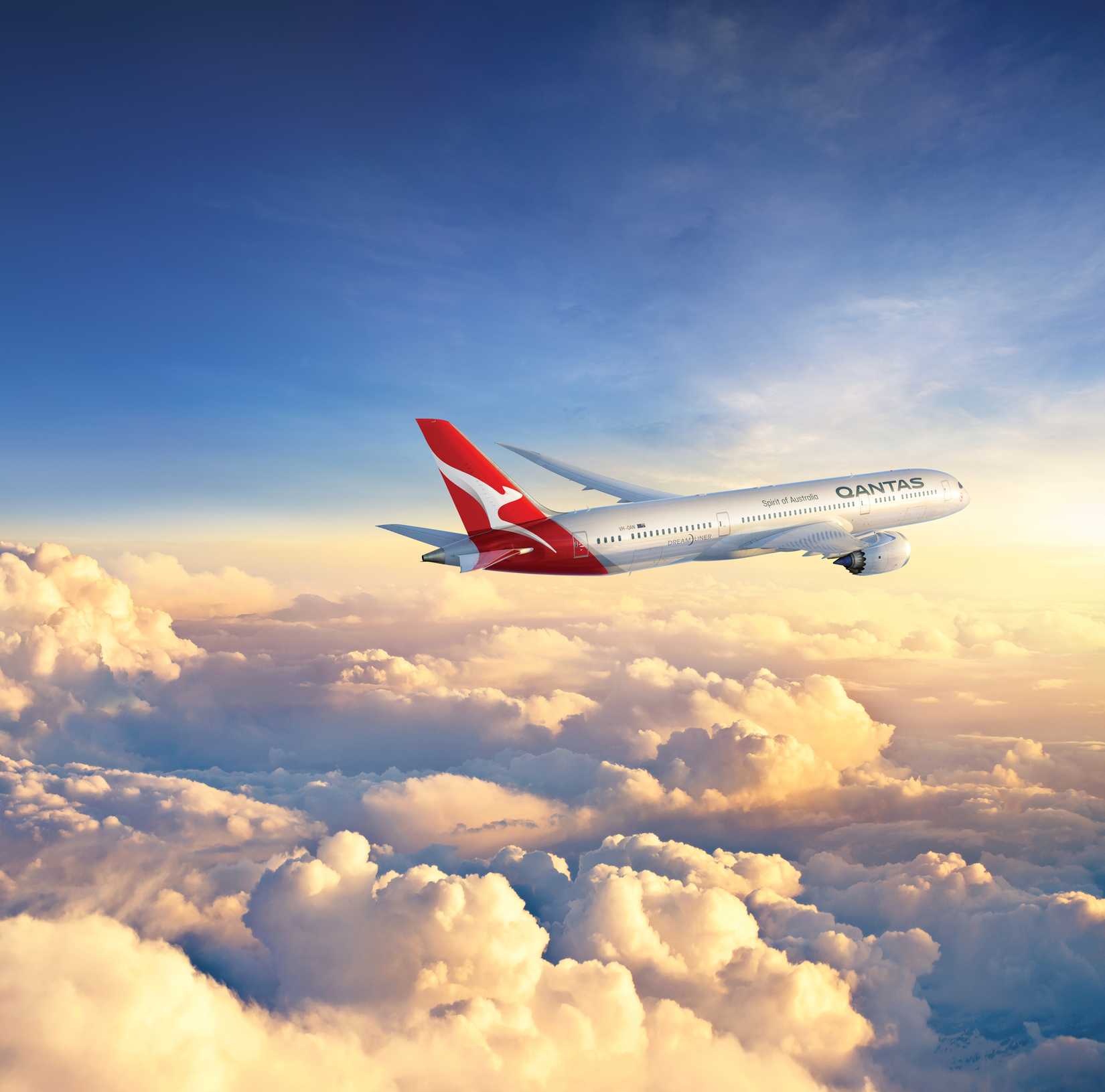 Qantas Boeing 787 flying above clouds