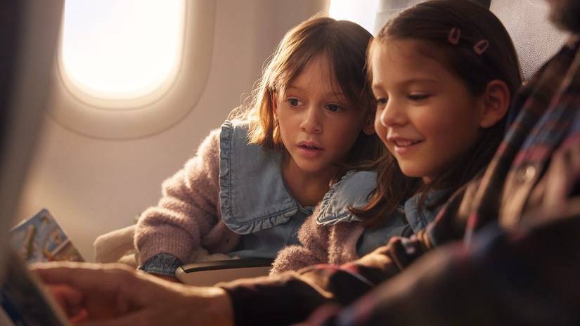 children seated in aircraft cabin
