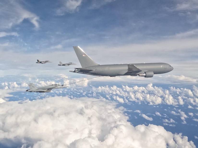 A KC-46A Pegasus, flown by an aircrew from the 79th Air Refueling Squadron, refuels three Royal Australian Air Force EA-18G Growlers.