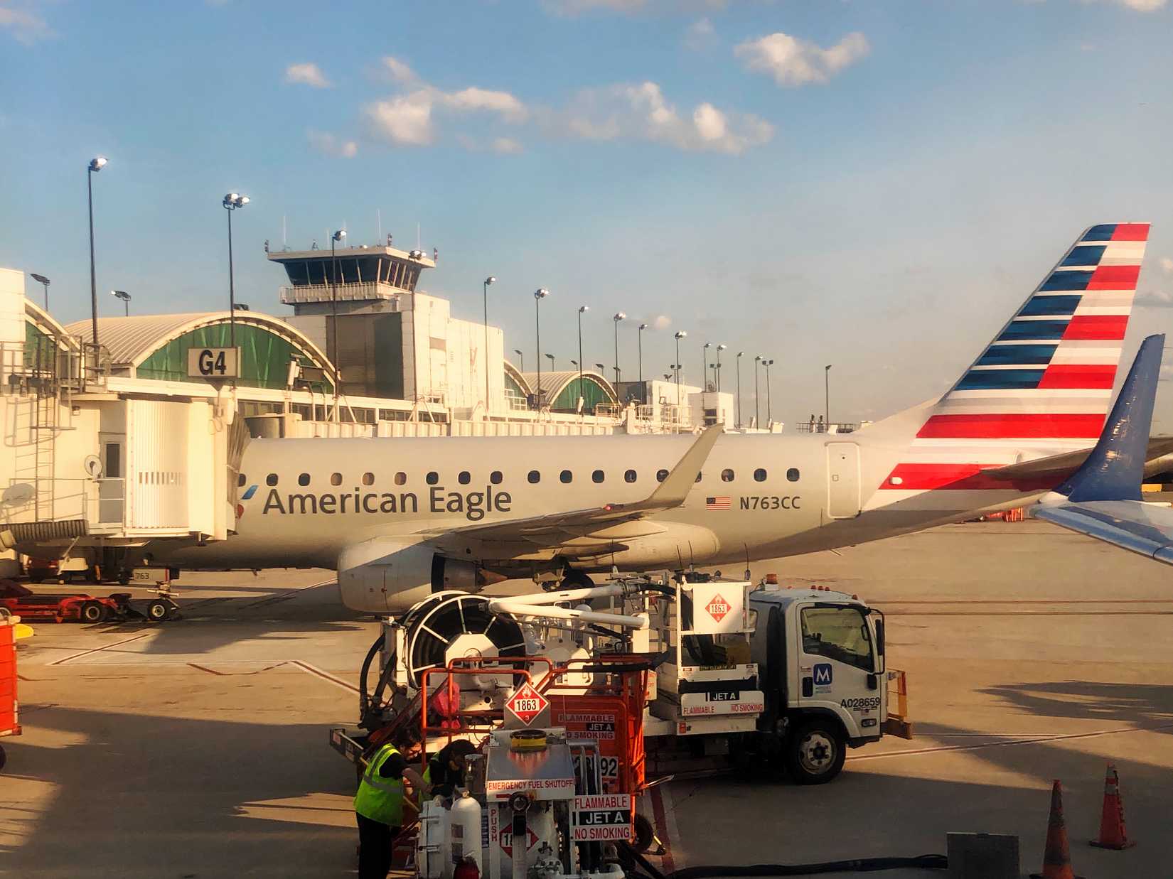 AE Envoy Air E170 parked at a gate at O'Hare