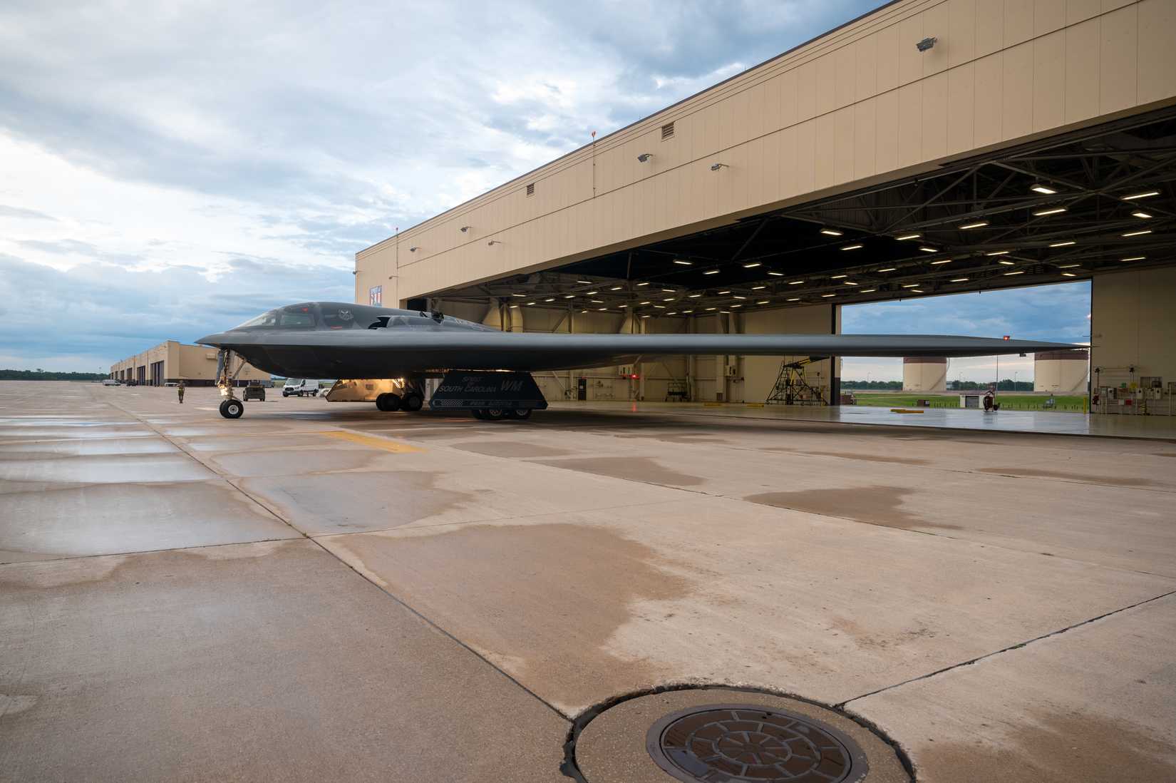 Air Force B-2 Spirit stealth bomber taxis out of a hangar in support of a Bomber Task Force deployment at Whiteman Air Force Base