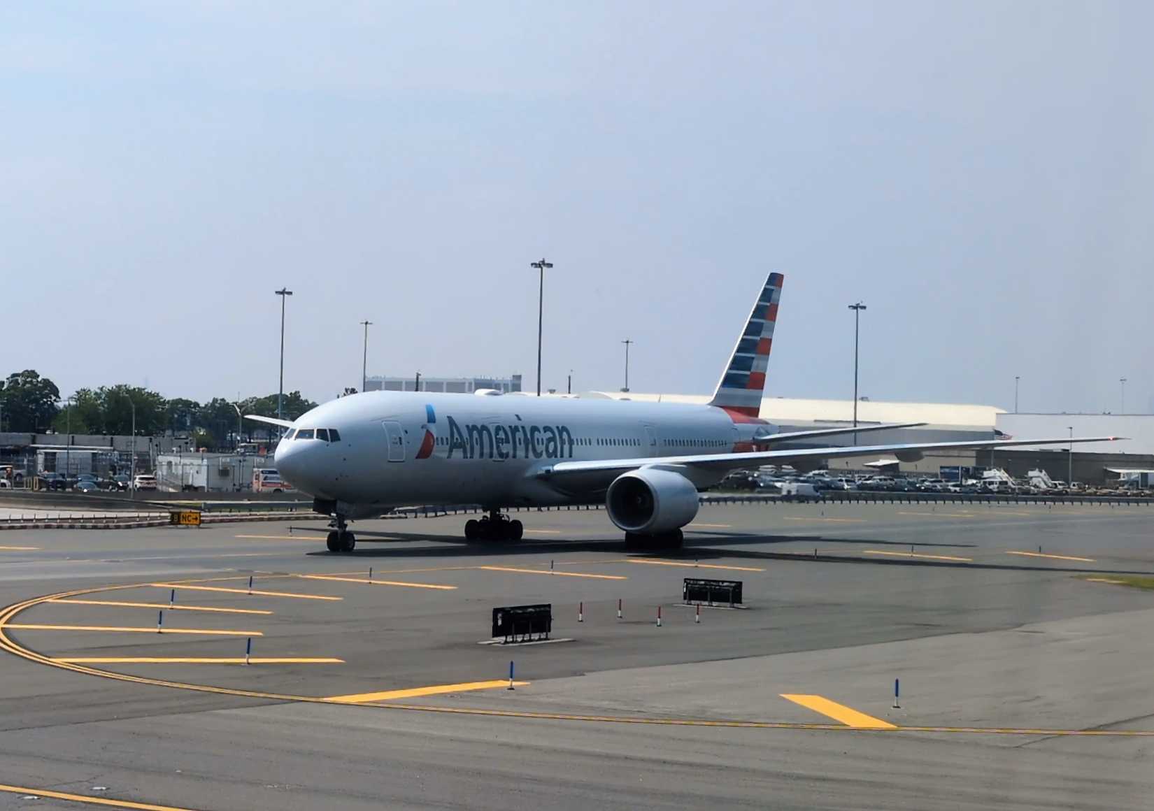American Airlines Boeing 777-300ER is taxing at John F Kennedy (JFK) International Airport.
