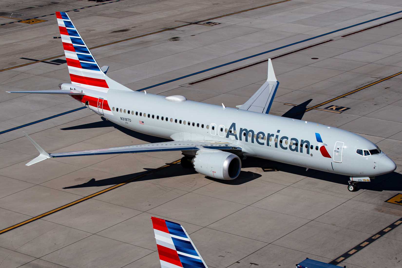 American Airlines passenger plane (Boeing 737-8 MAX  N318TD) taxiing to gate at Phoenix Sky Harbor International Airport (PHX)