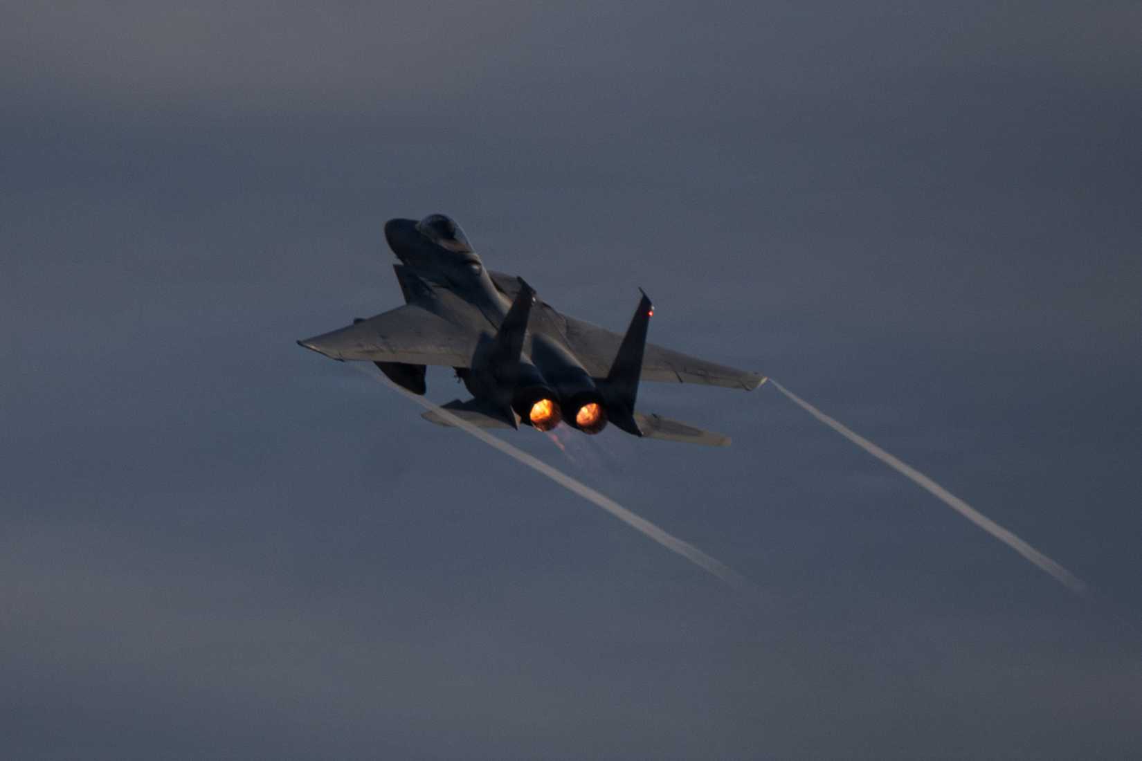 An F-15C Eagle aircraft flys over the flight line at Barnes Air National Guard Base, Westfield, MA.