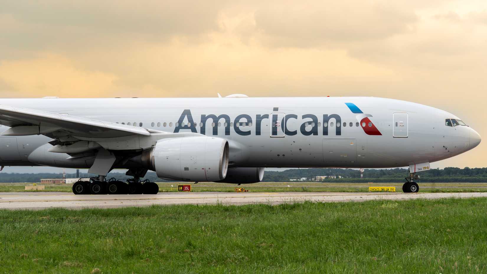 Boeing 777 American Airlines aircraft is taxiing at Milano Malpensa international airport.