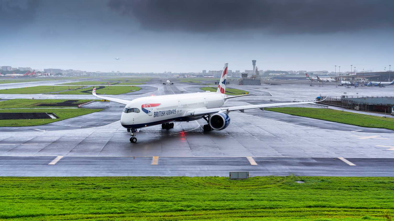 British Airways A350-1041 Preparing to Depart Mumbai in Wet Monsoon Season from Mumbai International Airport to London.