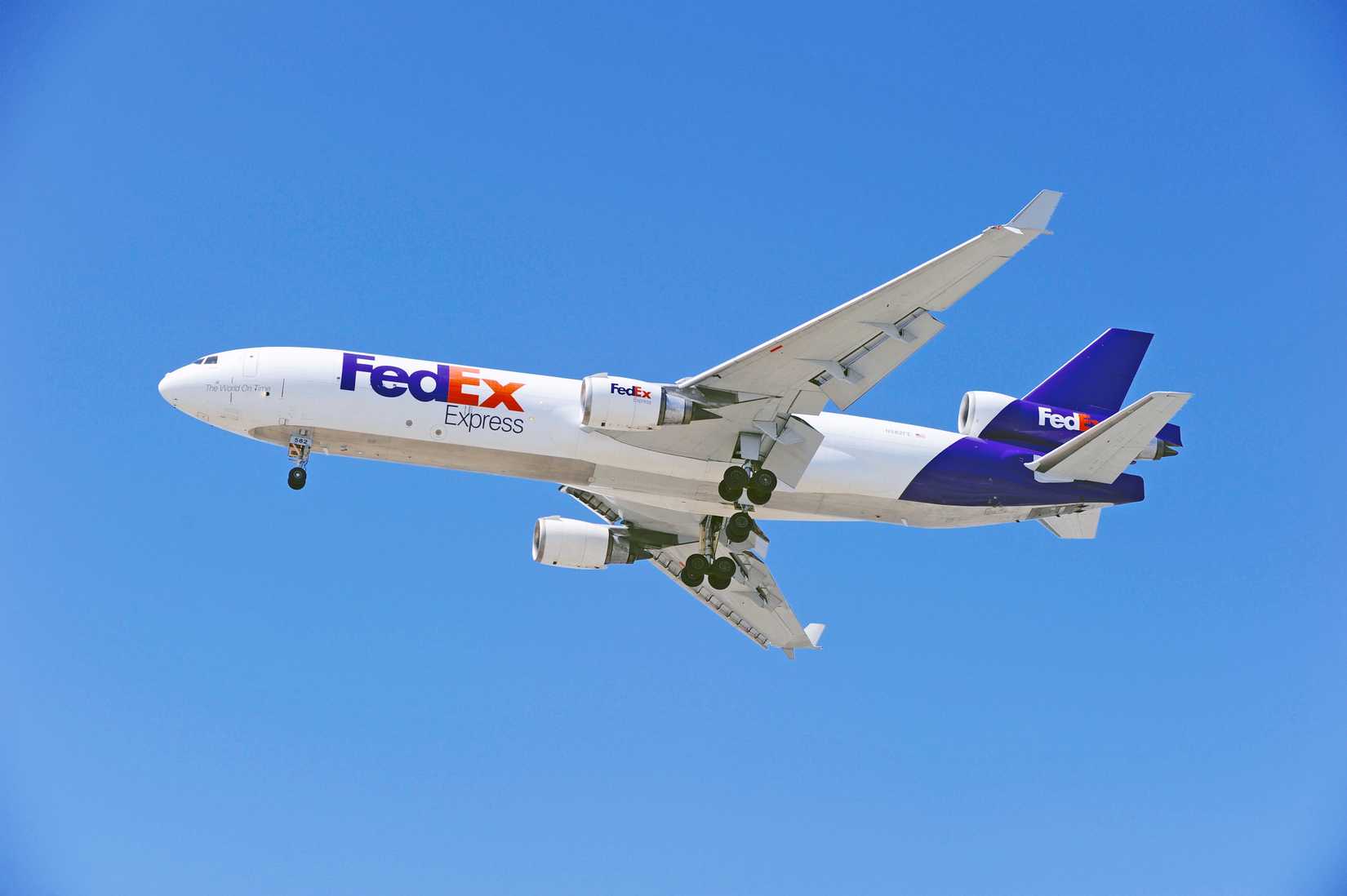 Federal Express McDonnell Douglas MD-11F cargo aircraft approaches runway