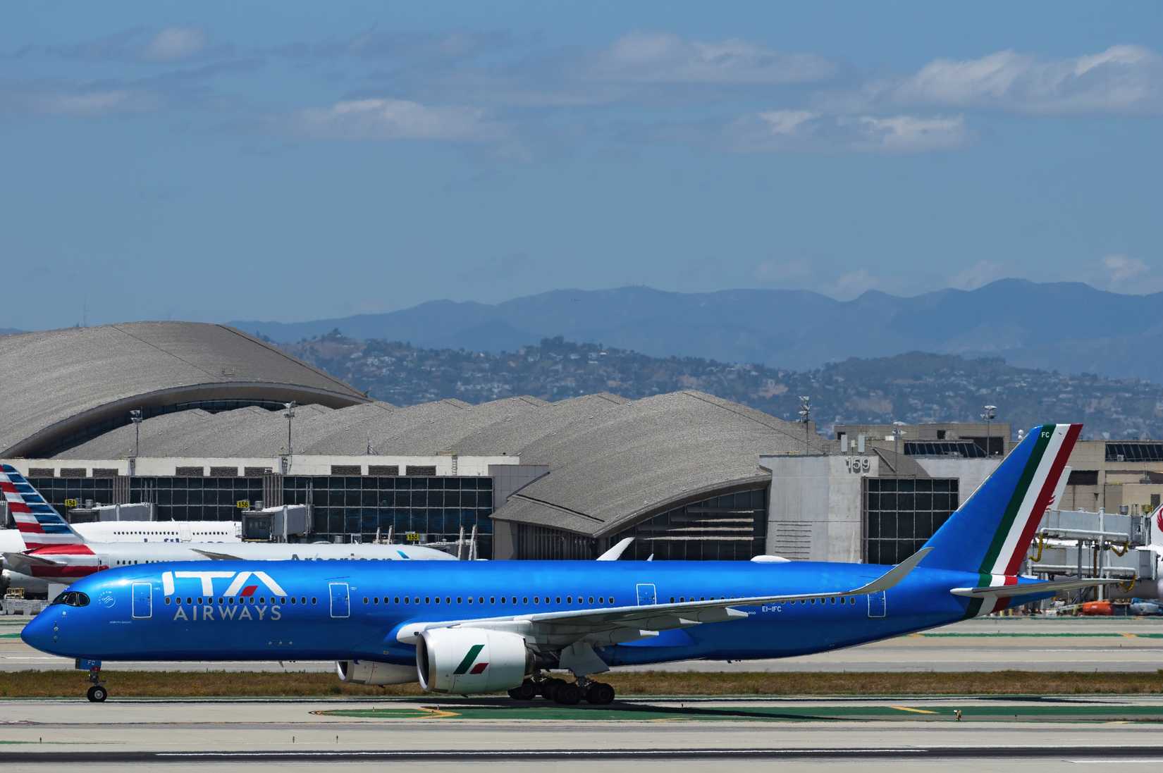 ITA Airways Airbus A350, EI-IFC, shown taxiing at LAX, Los Angeles International Airport.