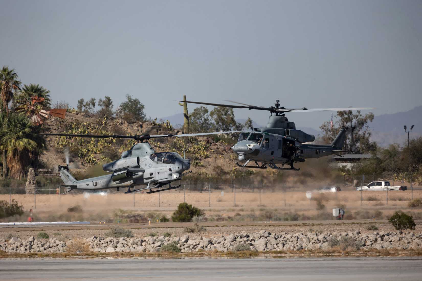 Marine Corps AH-1Z Viper, left, and a UH-1Y Venom both with Marine Medium Tiltrotor Squadron (VMM) 163 (Reinforced), 11th Marine Expeditionary Unit