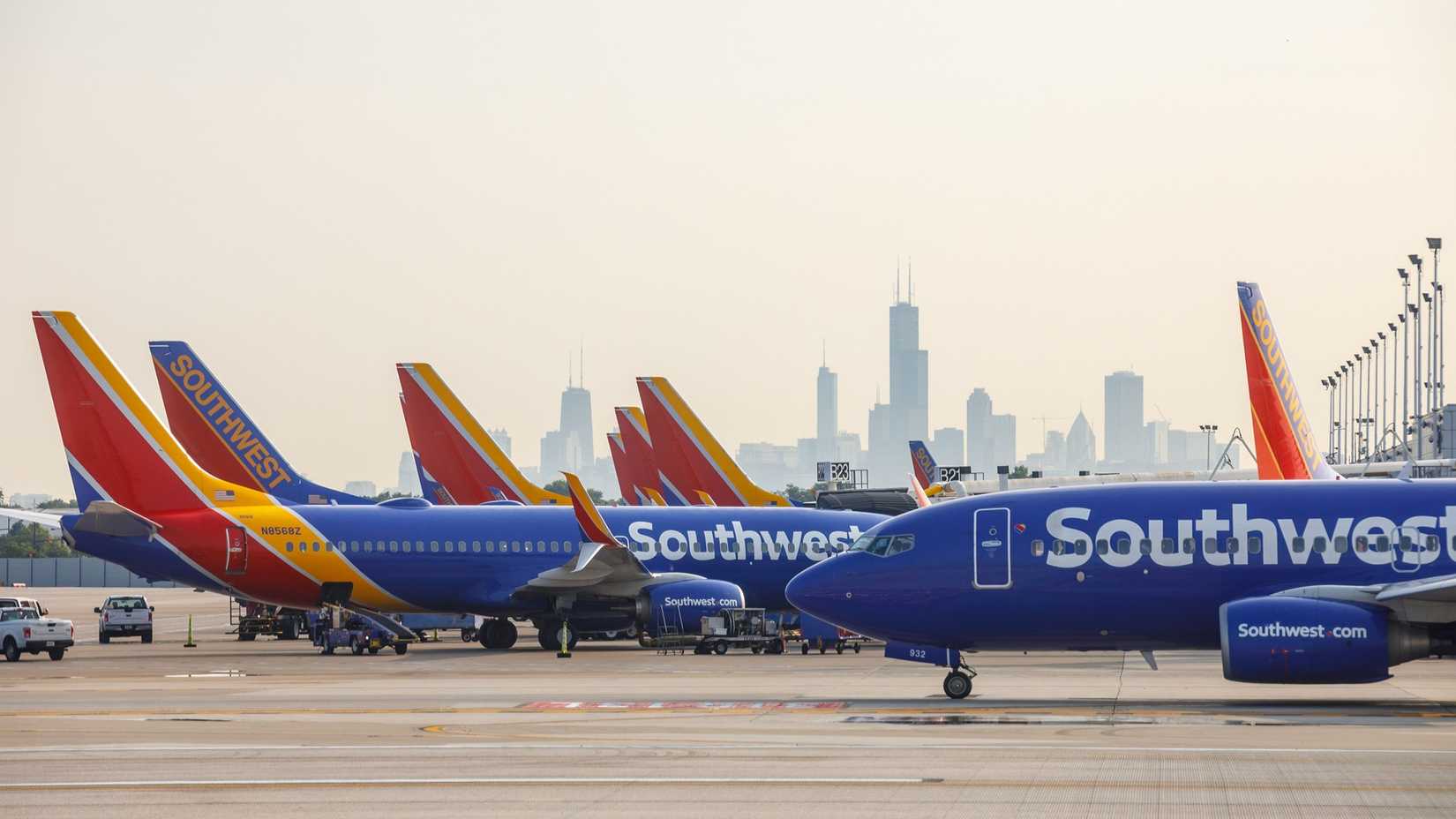 outhwest Airlines Boeing 737 airplanes prepare for takeoff and arrive as seen from another plane at Chicago Midway International Airport