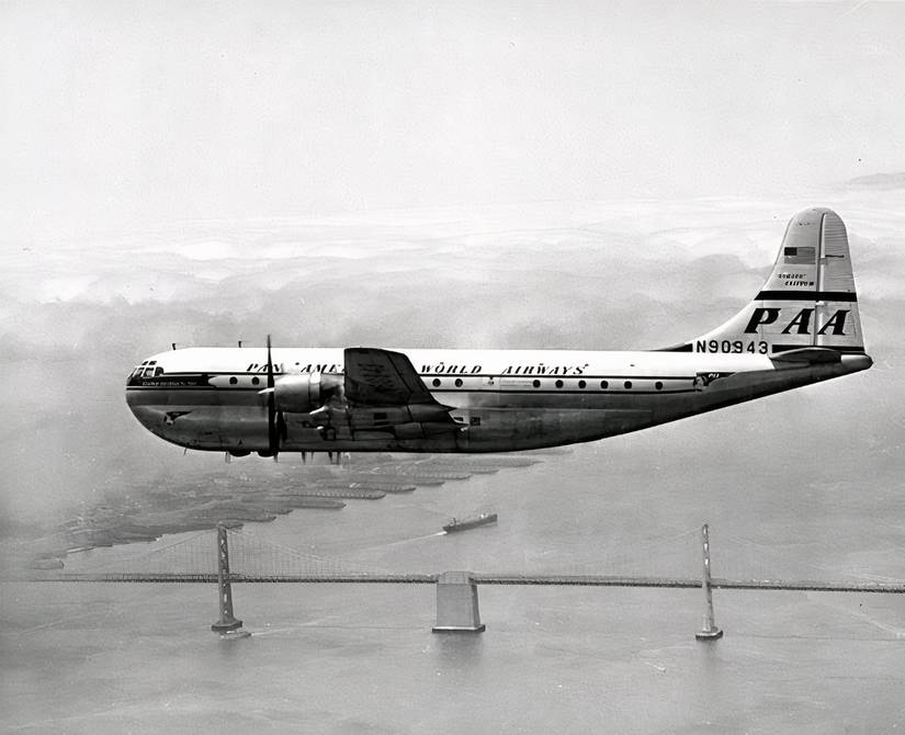 Pan_American_Airways_Boeing_377_Stratocruiser_over_San_Francisco-Oakland_Bay_Bridge_(4669579569)-1