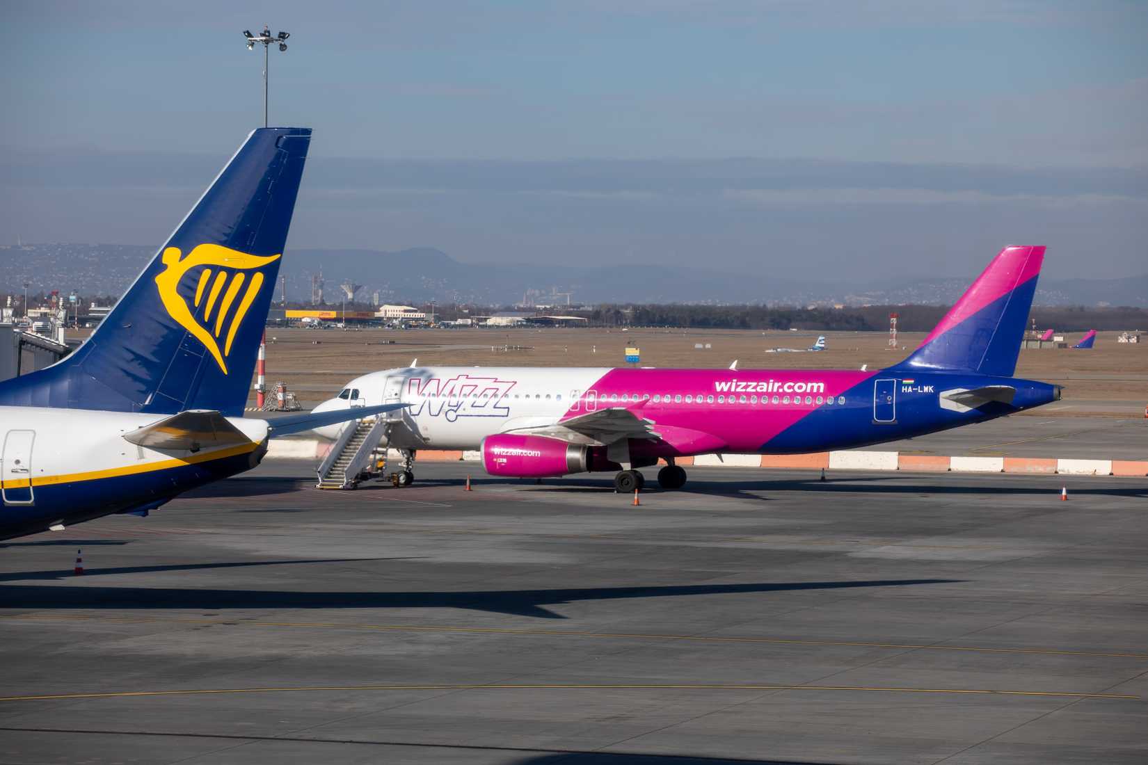 Wizz Air Airbus A320 and tail of Ryanair Boeing 737-800 aircraft