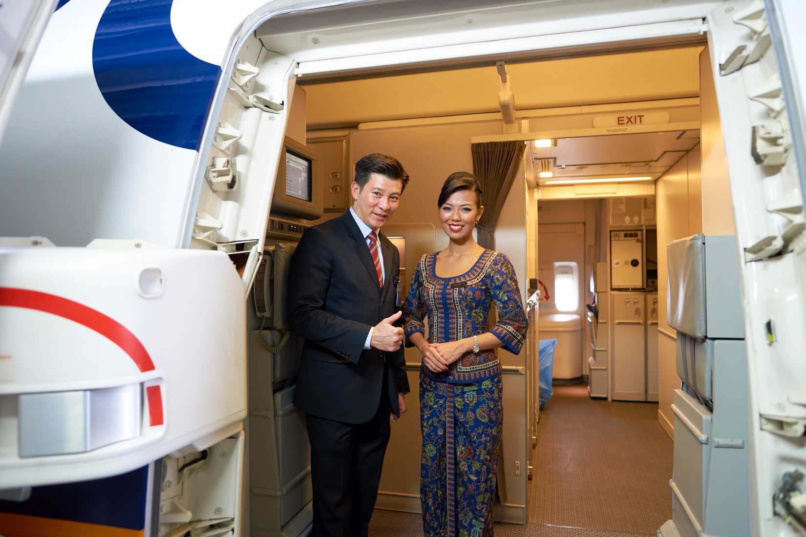 Singapore Airlines crew at aircraft door
