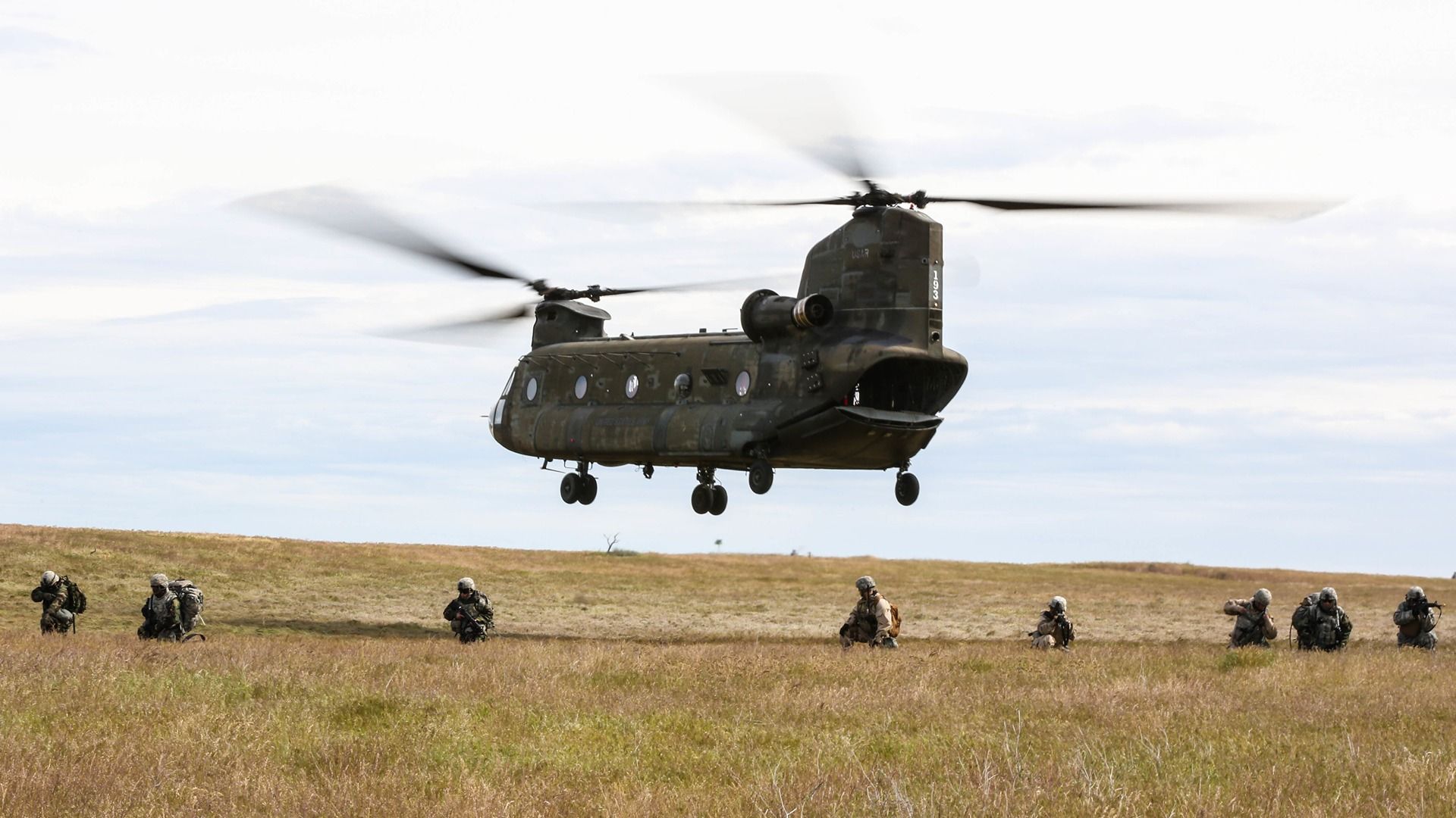 Soldiers conduct security for a departing CH-47 Chinook