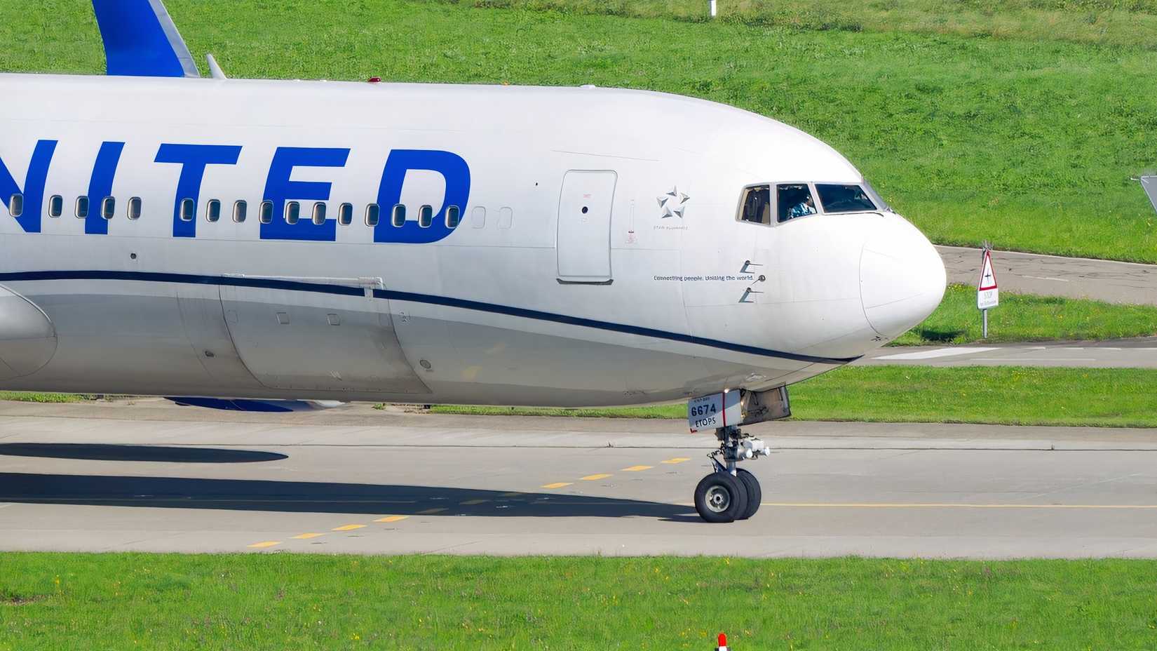 United Boeing 767-300ER taxiing to the runway ahead of another flight