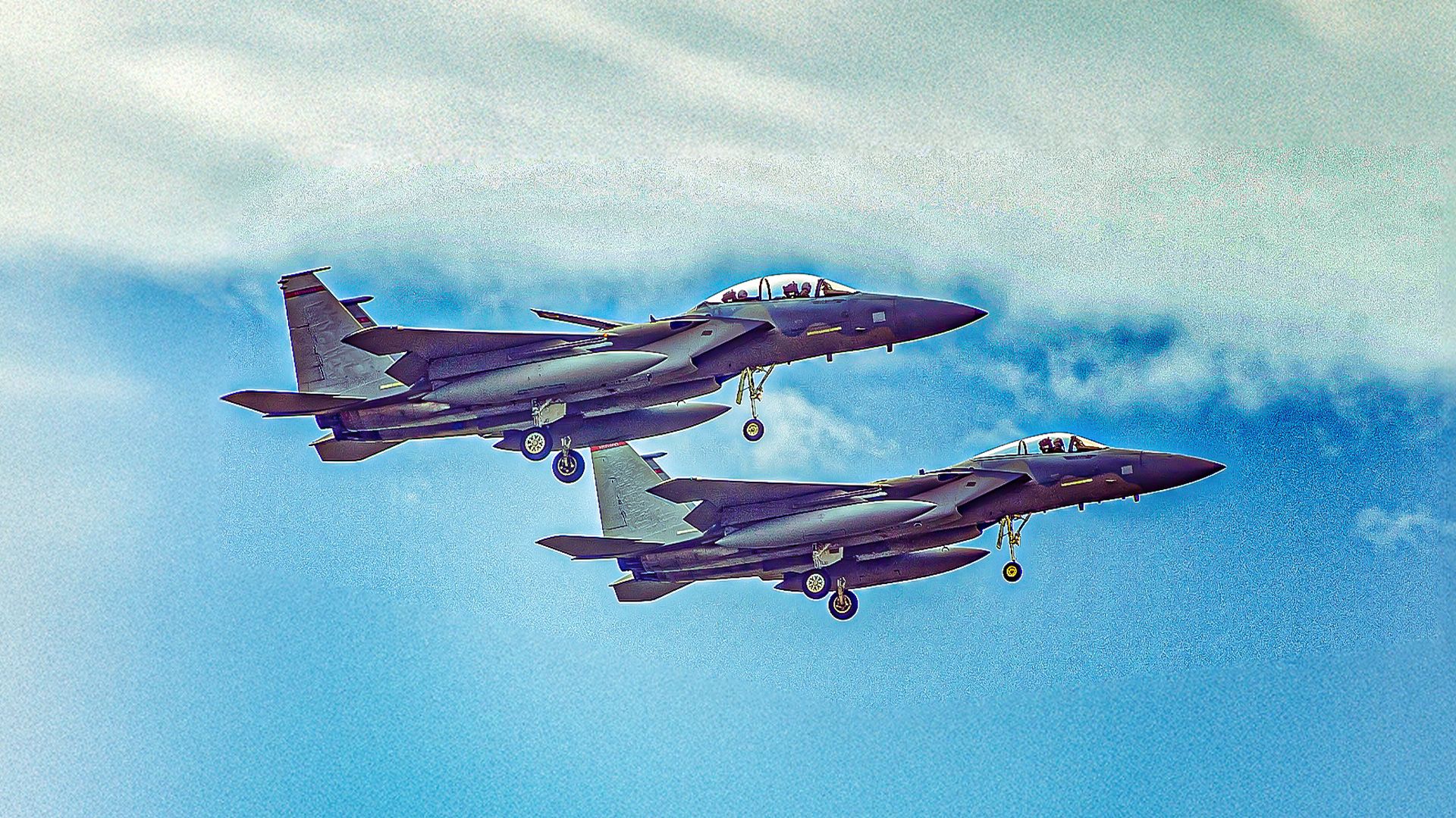 A Pair Of F-15 Eagles Cruising In The Sky