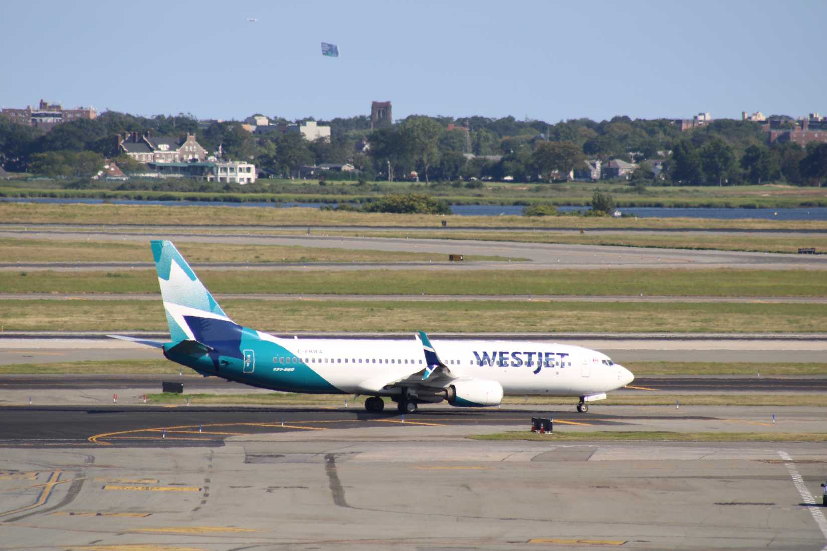 WestJet Boeing 737-8 Max operating at John F Kennedy (JFK) International Airport.