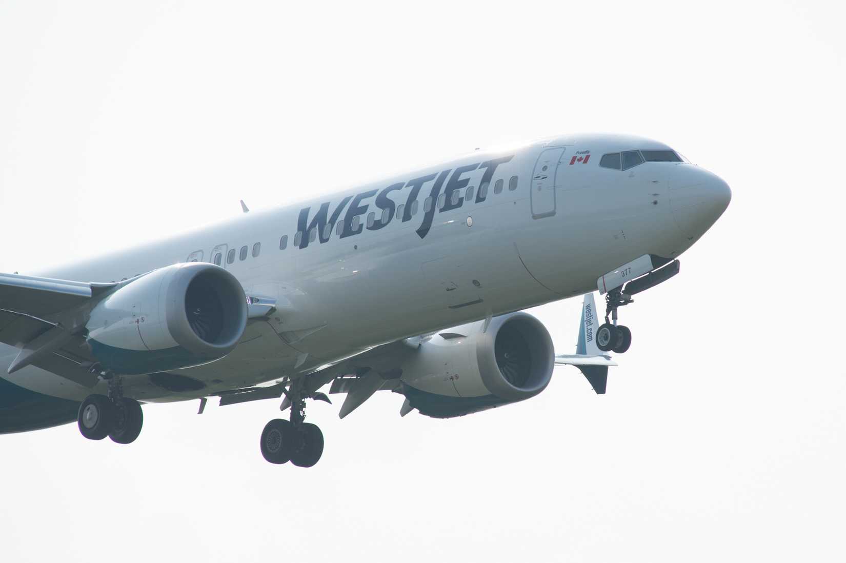 WestJet Boeing 737 MAX 8 lands at Toronto Pearson International Airport.