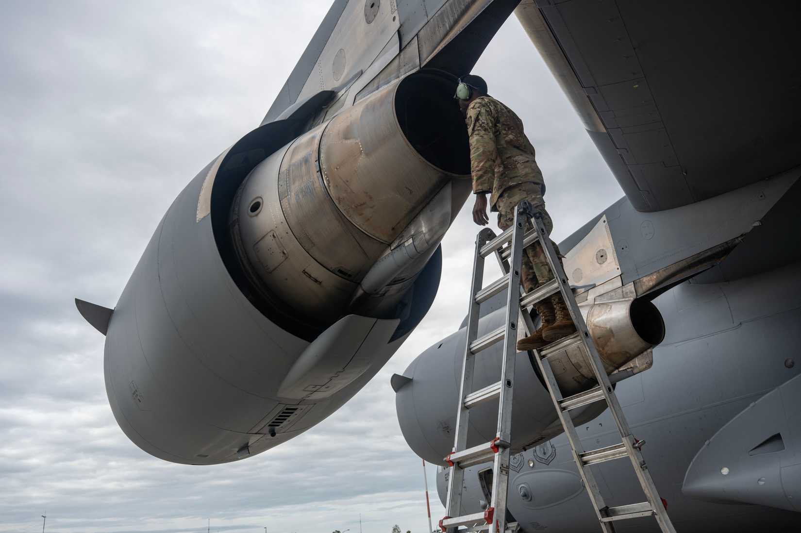 62d Aircraft Maintenance Squadron crew chief, checks a C-17 Globemaster III engine during Operation KENNEY STRIKES BACK at Royal Australian Air Force Base Amberley