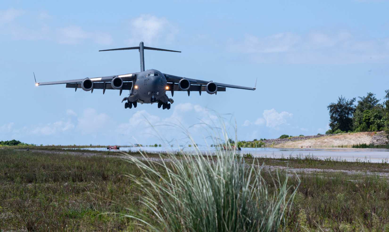 A C-17 Globemaster III assigned to the 62d Airlift Wing lands an assault landing zone in Guam.