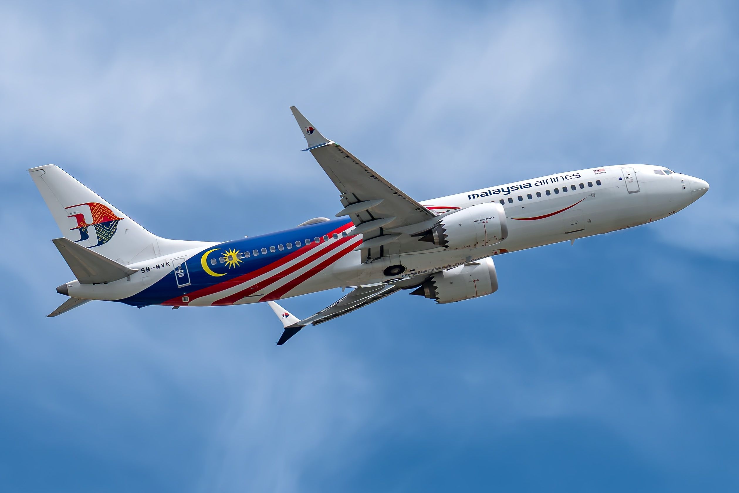 A Malaysia Airlines Boeing 737 MAX 8 aircraft departing out of Changi International Airport.
