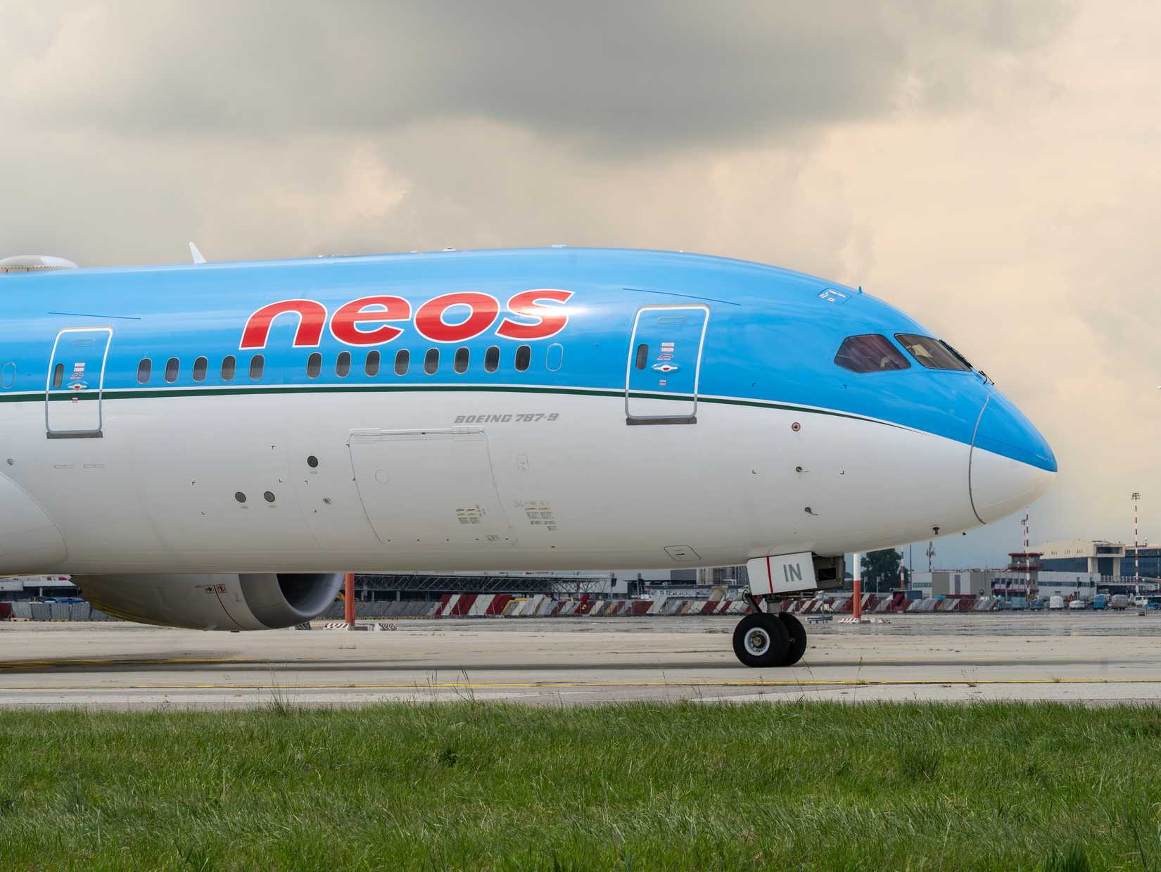 A Neos Boeing 787 Dreamliner is taxiing to the runway at MXP Milano Malpensa international airport.