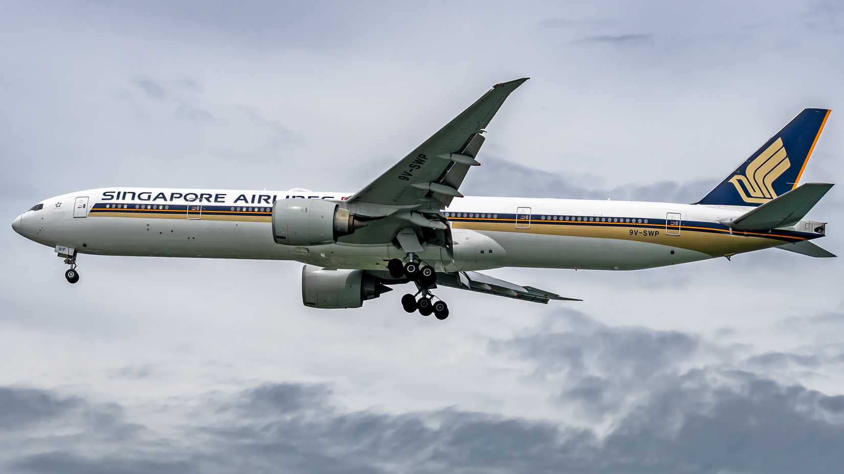 A Singapore Airlines Boeing 777-300ER aircraft departing out of Changi International Airport.
