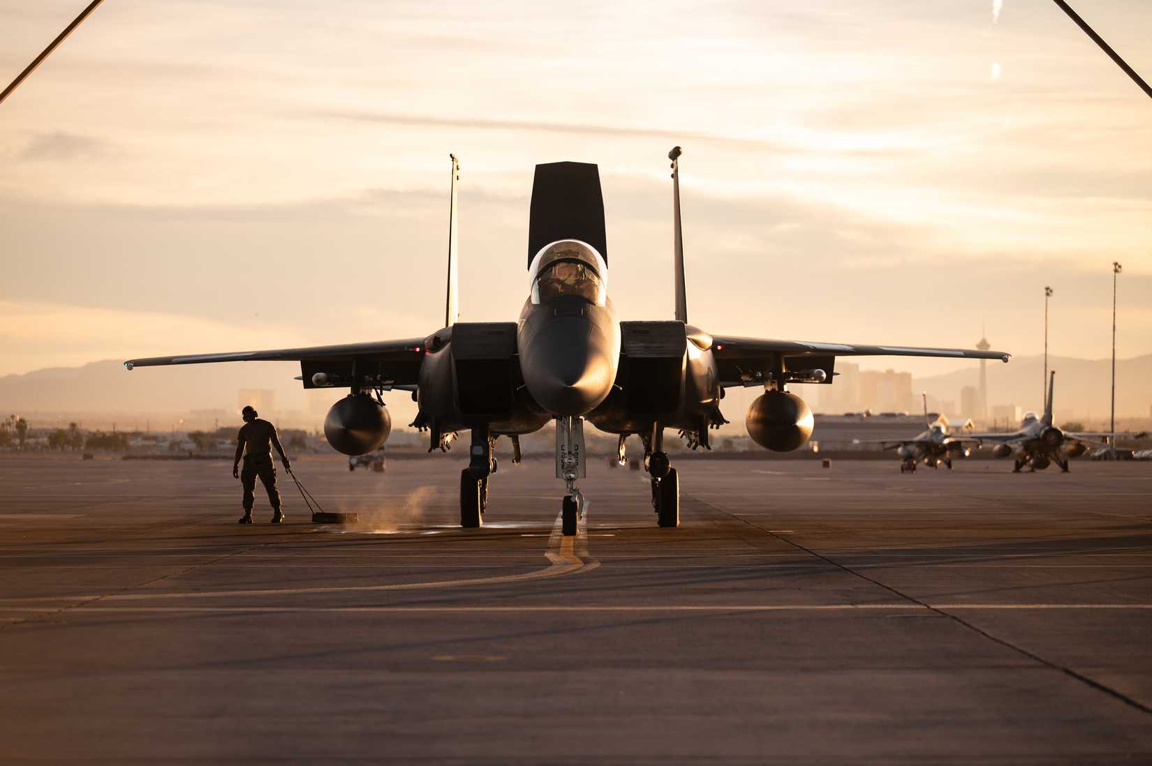 Air Force Airman 1st Class Quamyre Quinn, a crew chief assigned to the 757th Aircraft Maintenance Squadron, removes chalks from an F-15E Strike Eagle.