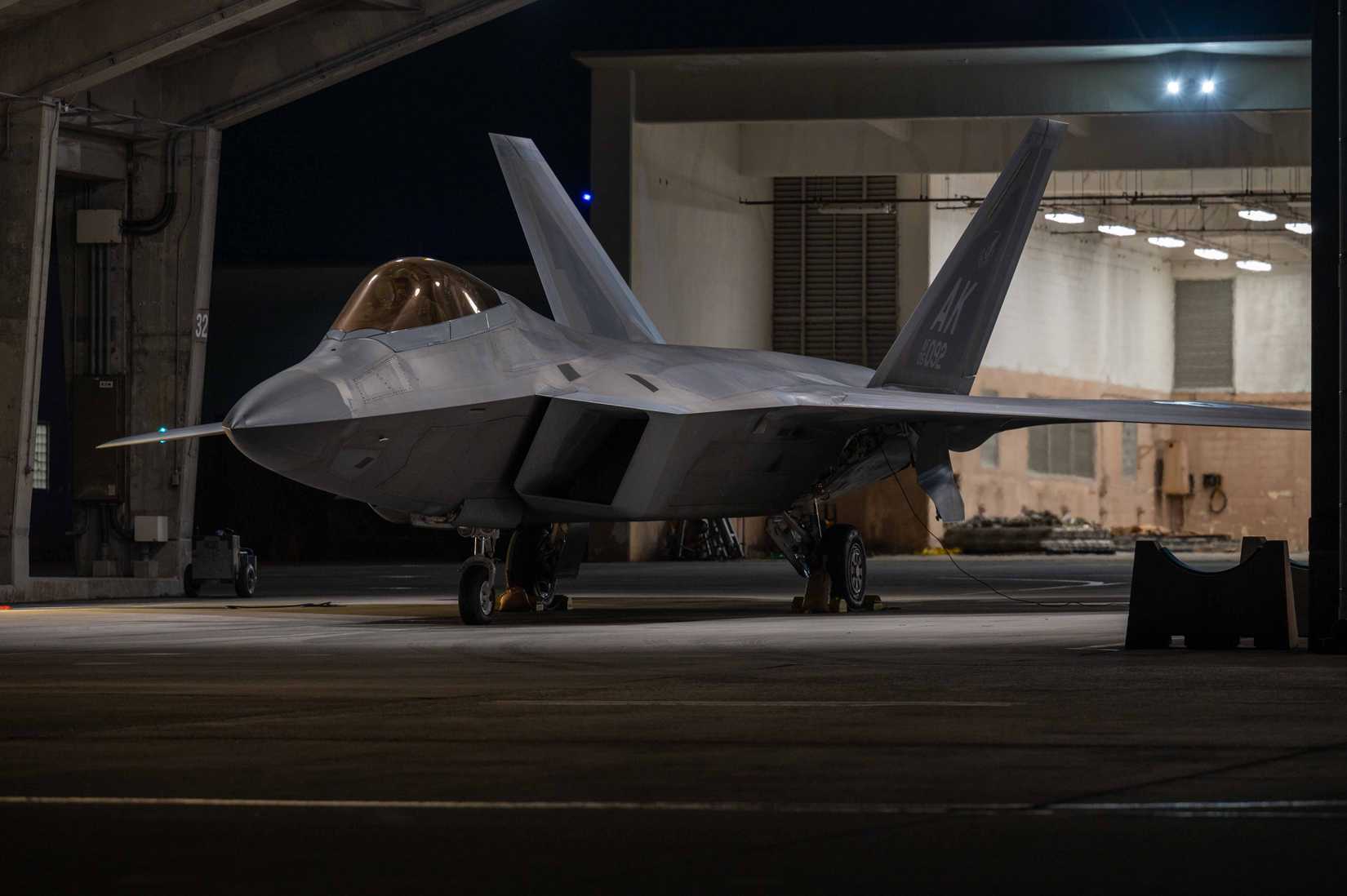 Air Force F-22A Raptor assigned to the 525th Expeditionary Fighter Squadron sits parked in a flow-through during a base-wide readiness exercise at Kadena Air Base.