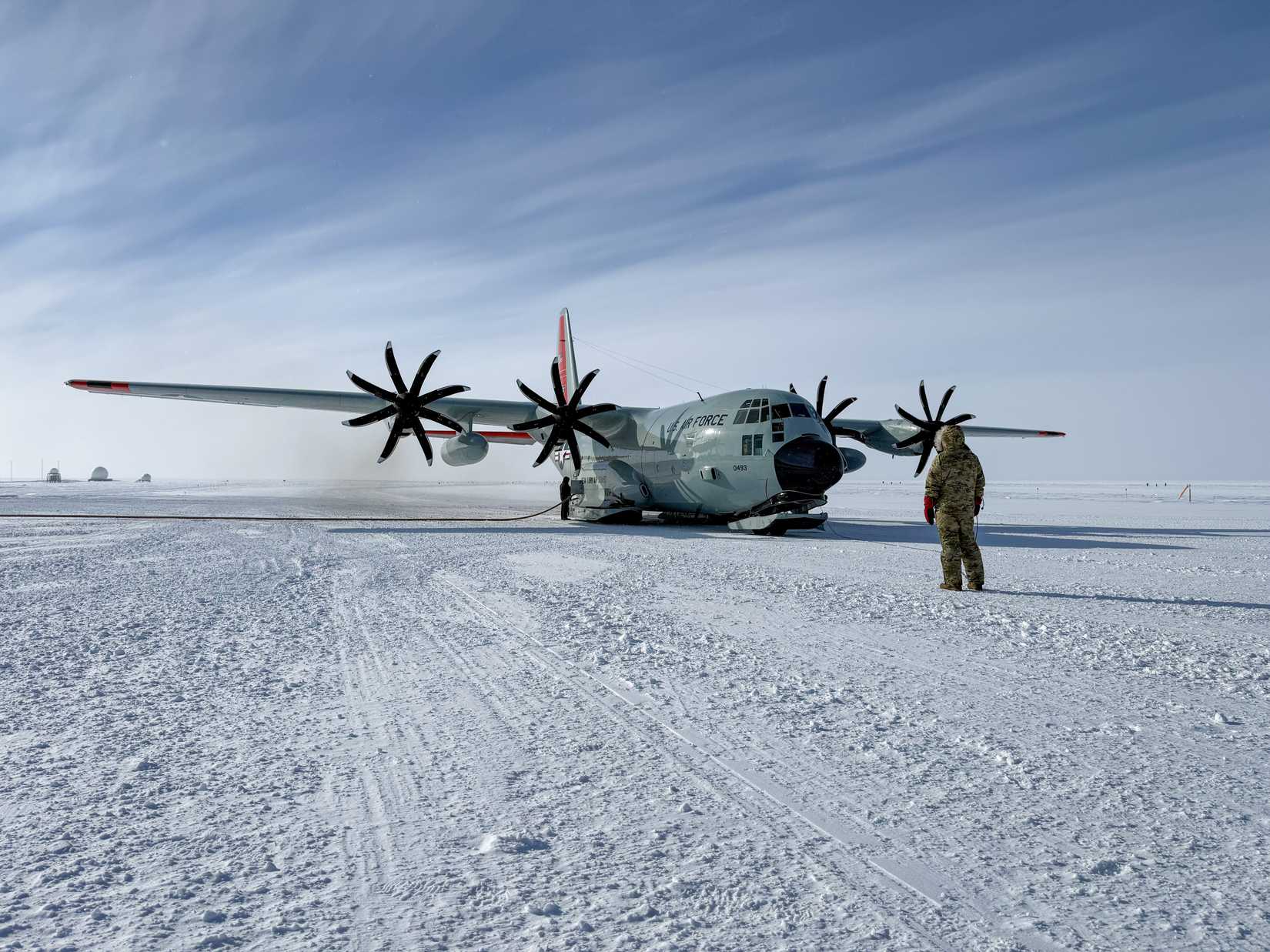 Air National Guard Capt. Jacob Reisler and Tech. Sgt. Jacob Walen, members of the 109th Airlift Wing, refuel a LC-130 Hercules at the Amundsen-Scott South Pole Station