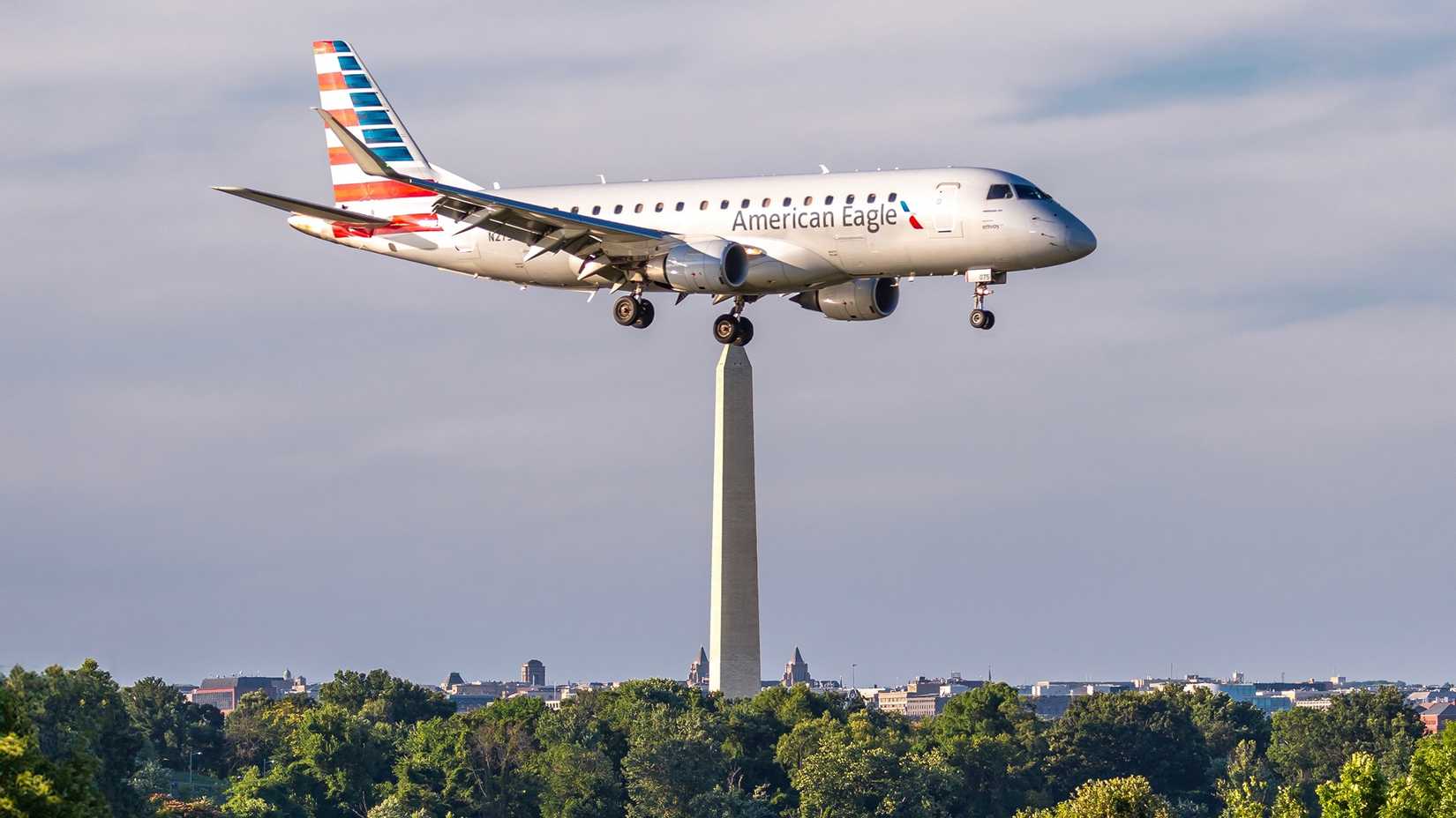 An American Eagle Embraer regional jet, operated by Envoy Air, lands at Ronald Reagan National Airport.