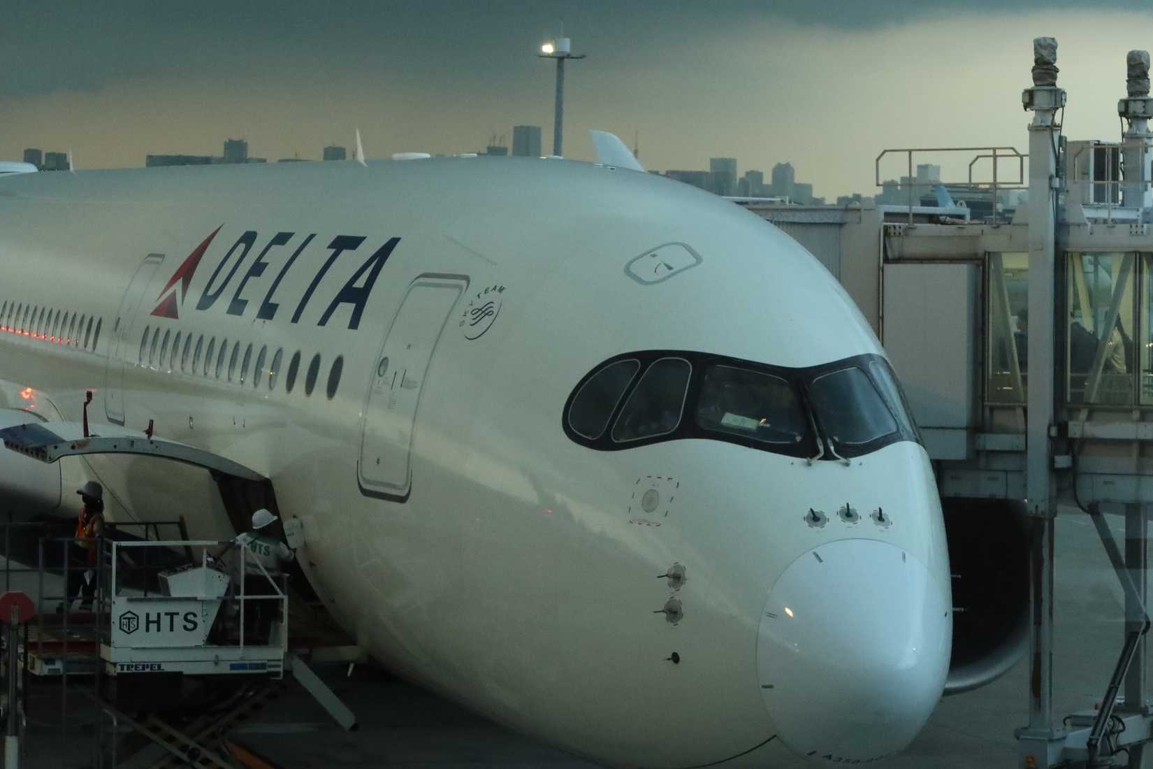 Delta Air Lines DL296 A350 before departure from Haneda Airport during storm in Tokyo, Japan.