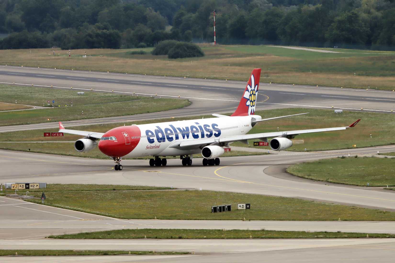 Edelweiss Air Airbus A340 HB-JMF - taxiing to the gate after landind on runway 14