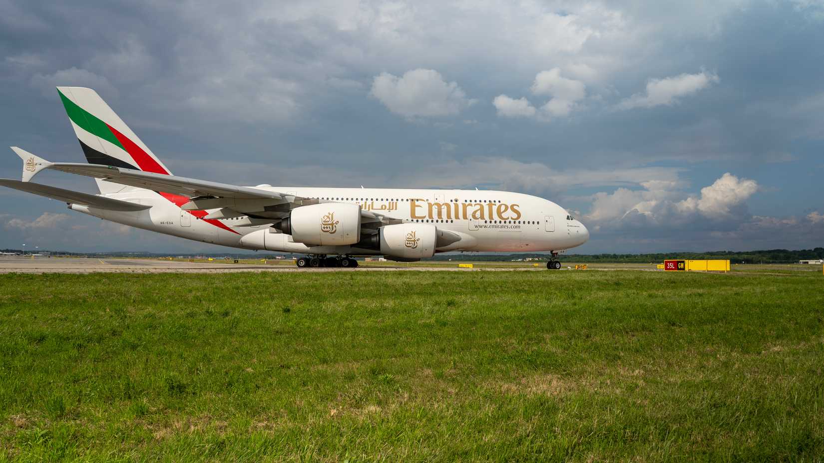 Emirates Airbus A380 is taxiing at MXP Milano Malpensa international airport.