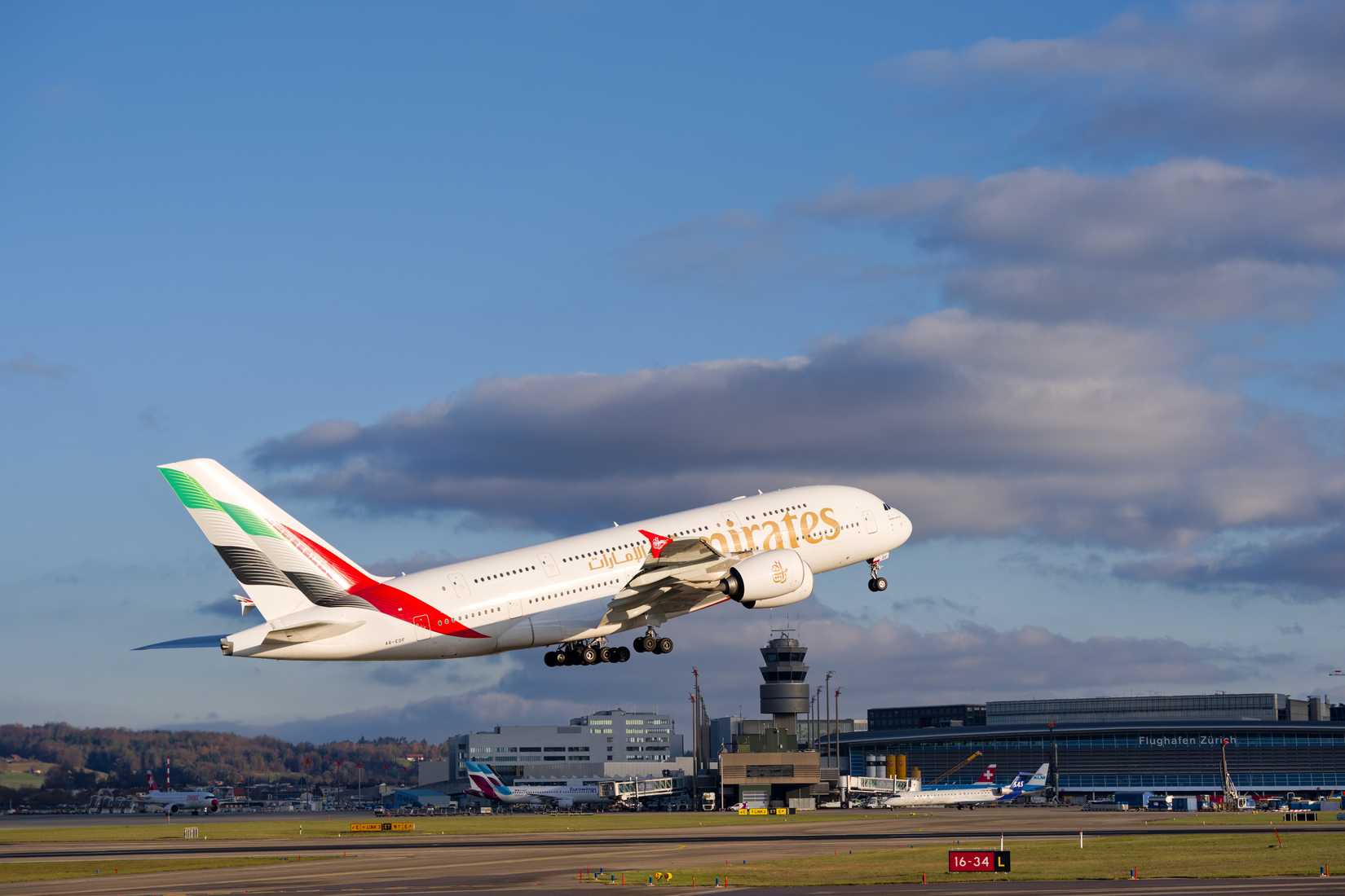 Emirates passenger airplane Airbus A380-800 registration A6-EDF taking off form Swiss Zürich Airport.