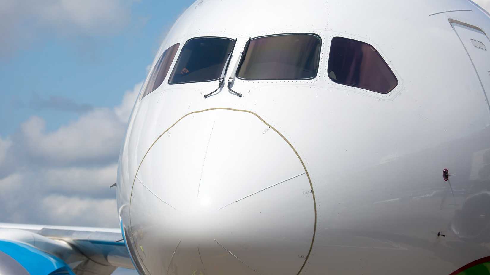 Front view of a white 787 airplane