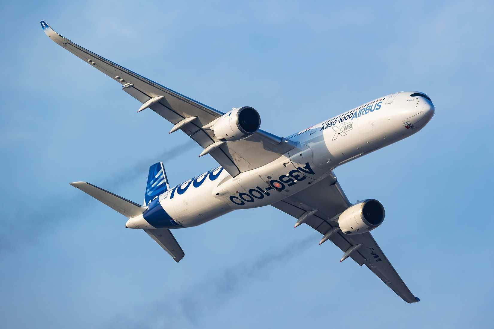 Airbus A350-1000 passenger plane. A350 airliner in factory design livery. Airshow flying display.