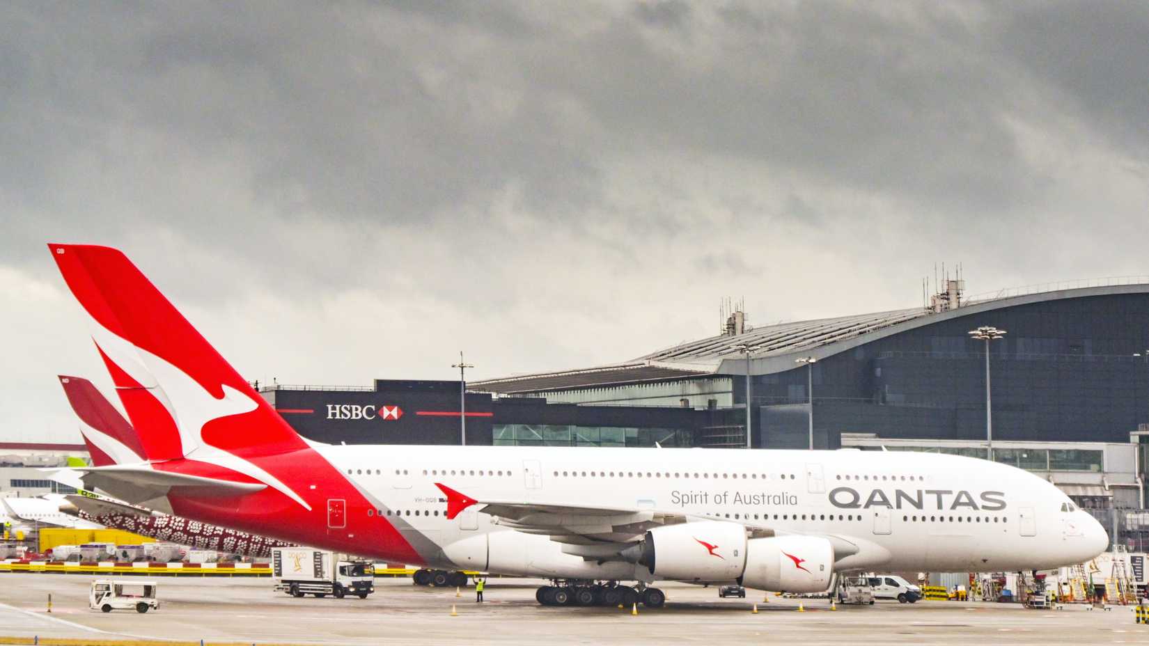 Qantas Airbus A380 jet parked at terminal 3 at Heathrow airport.