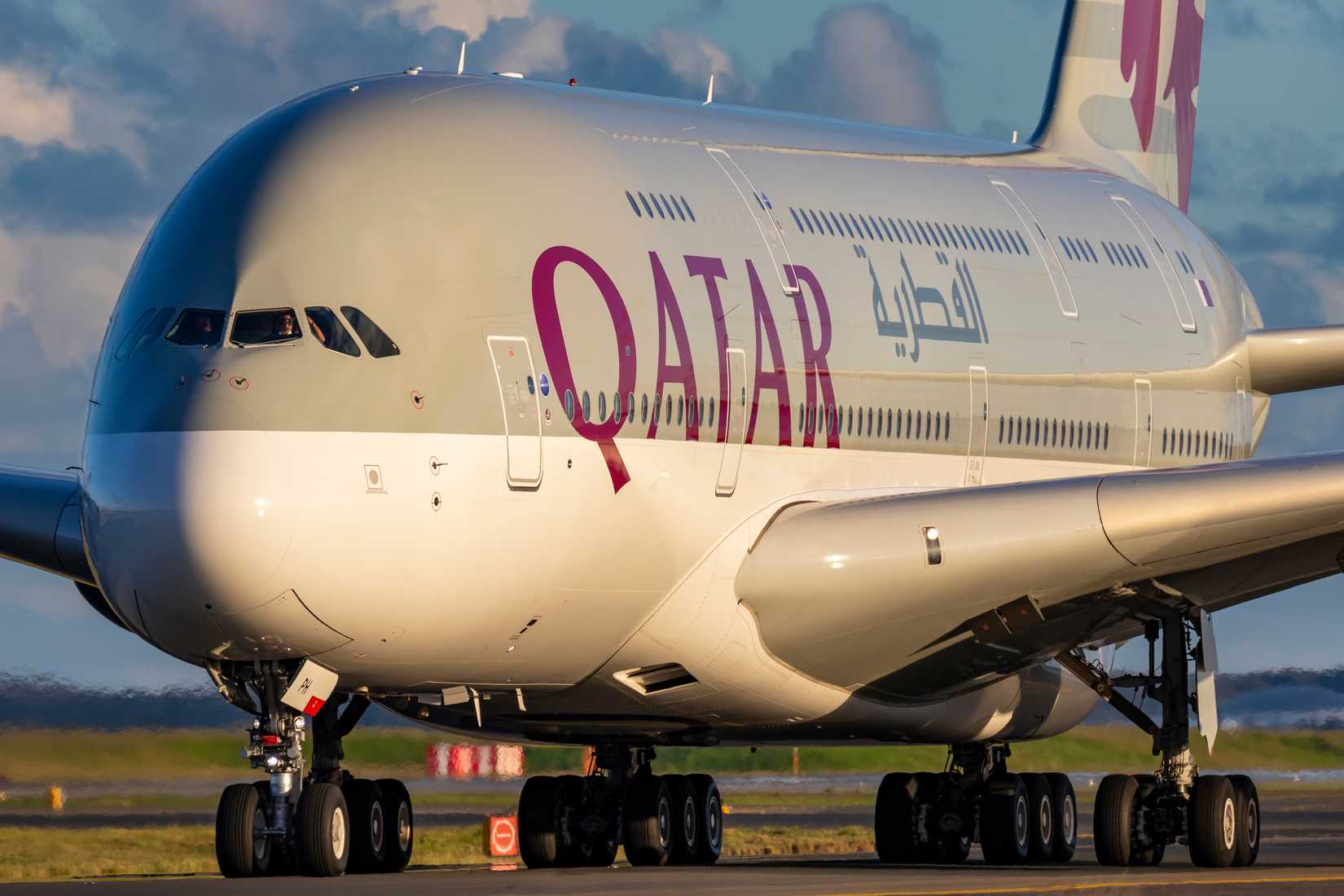 Qatar Airways A380 taxiing to the gate at Sydney International Airport.