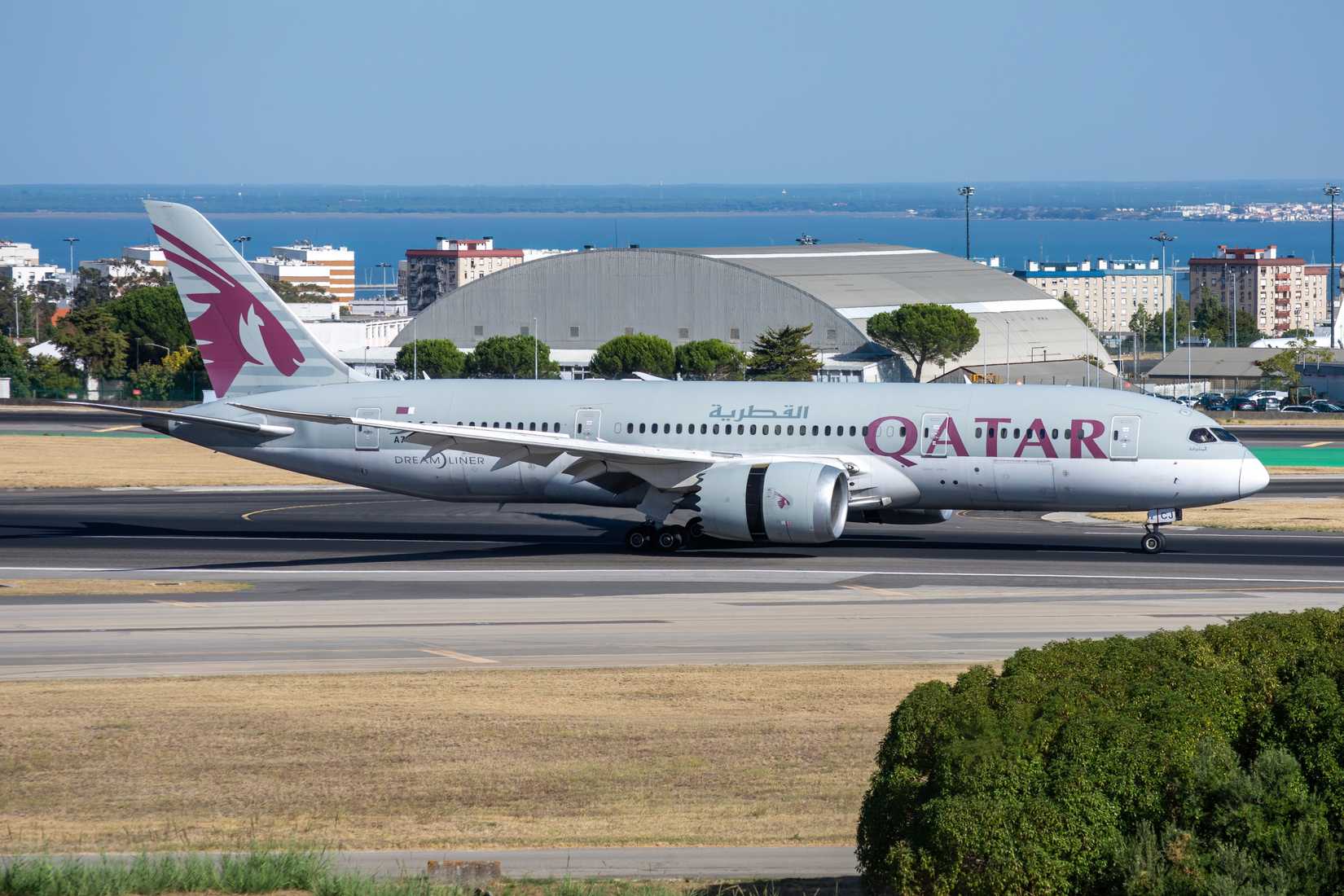 Qatar Airways Boeing 787-8 long-haul airliner landing at Lisbon airport with registration A7-BCJ.