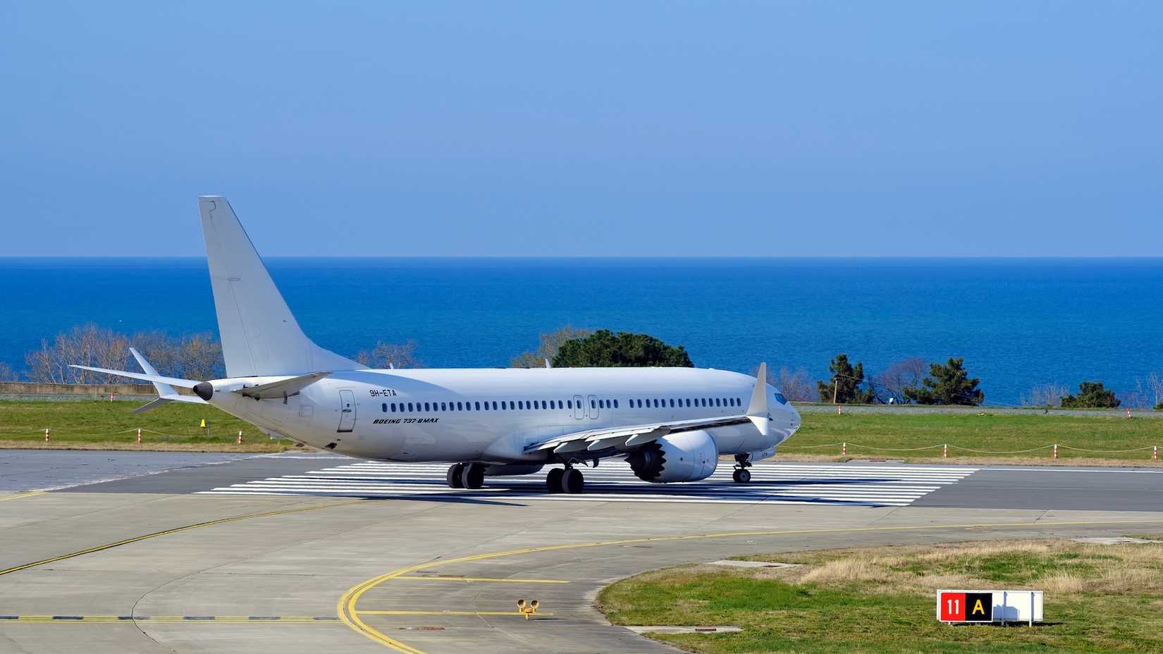 A Boeing 737 MAX Aircraft Taxiing Onto The Runway