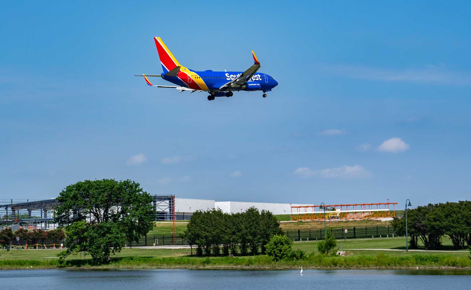 Southwest Boeing 737 flying over Bachman Lake to land at Love Field
