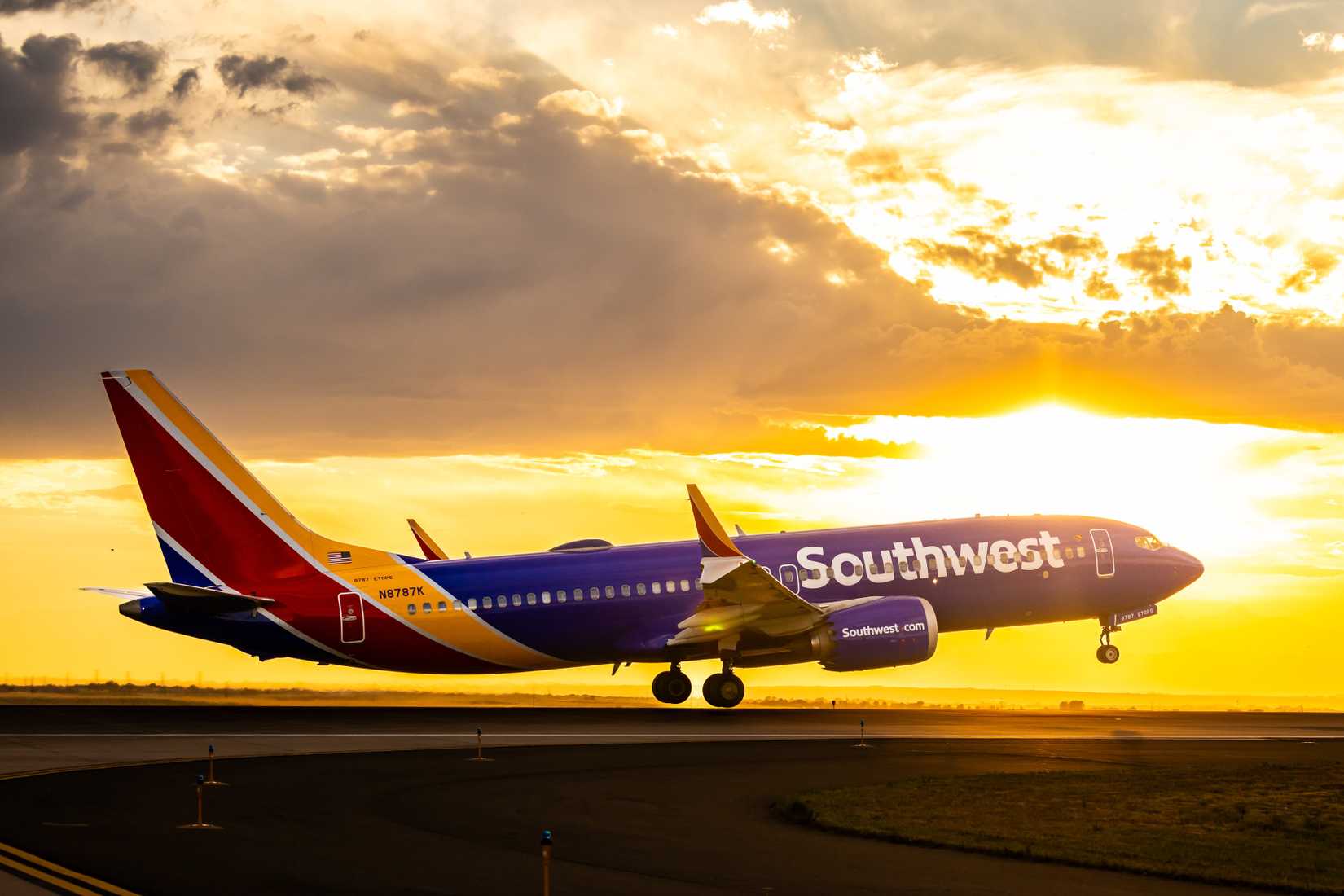 Southwest Airline Boeing 737 landing at sunset