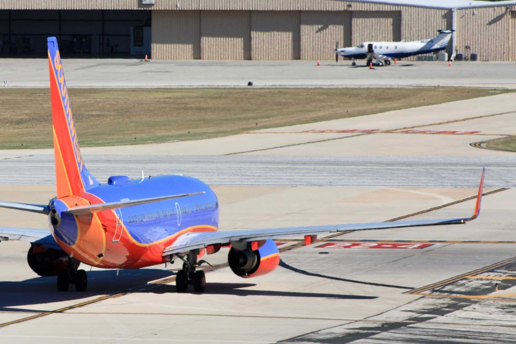 A Boeing 737-700 of Dallas-based Southwest Airlines preparing for departure at San Antonio International Airport.