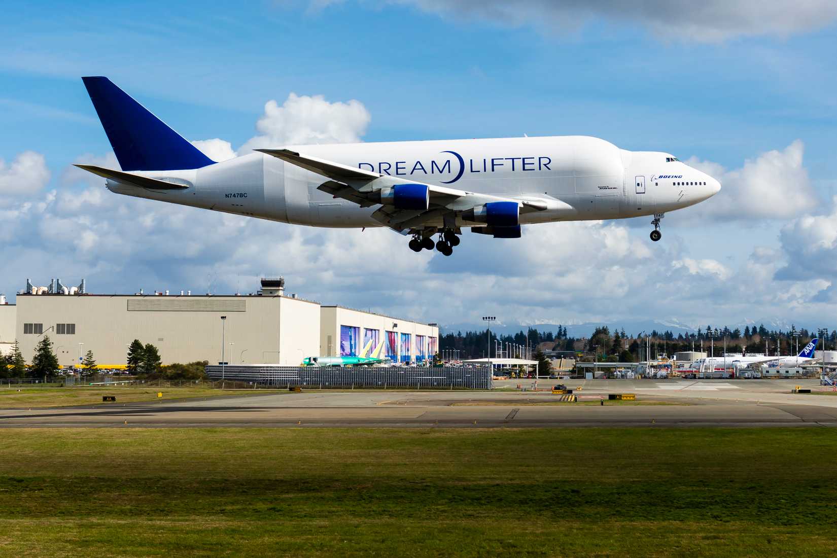 A Boeing 747-400 Large Cargo Freighter (LCF), known as 'Dreamlifter' is arriving at Boeing's Everett Airfield with parts for the Boeing 787 program.