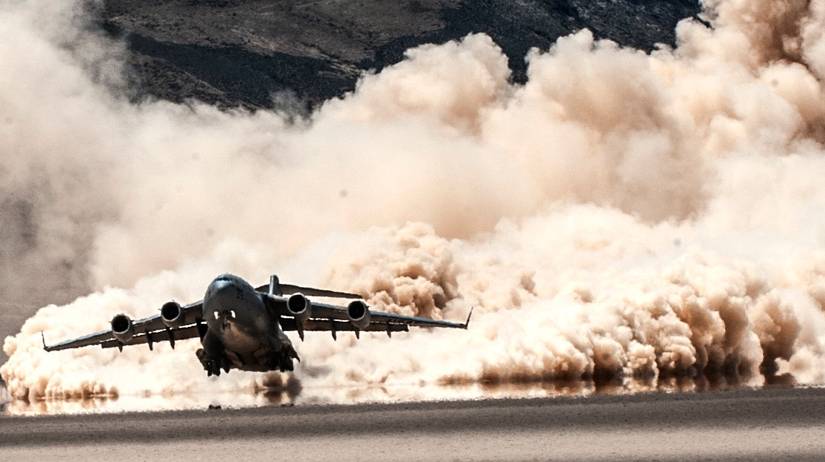A C-17 Globemaster III takes off from a dry lake bed during a composite mission application exercise on the Nevada Test and Training Range.