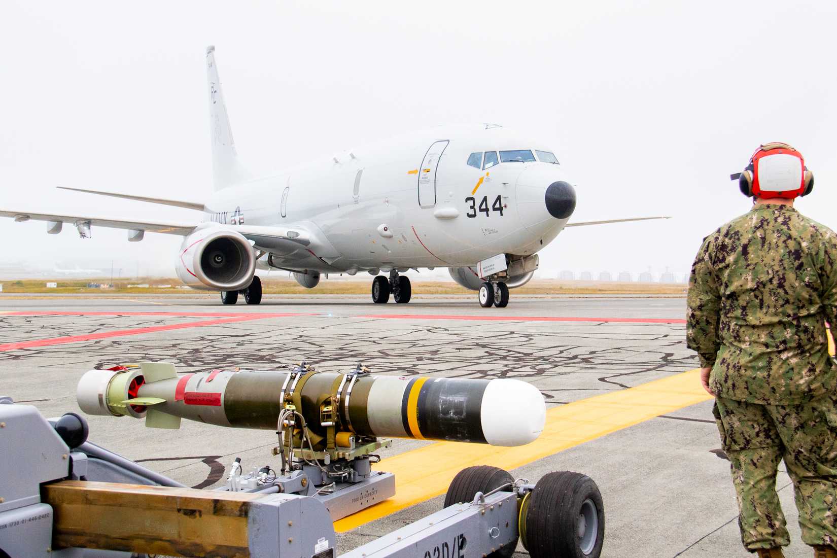 A P-8A Poseidon assigned to Patrol Squadron (VP) 46, the ‘Grey Knights,’ taxis into the combat aircraft loading area.