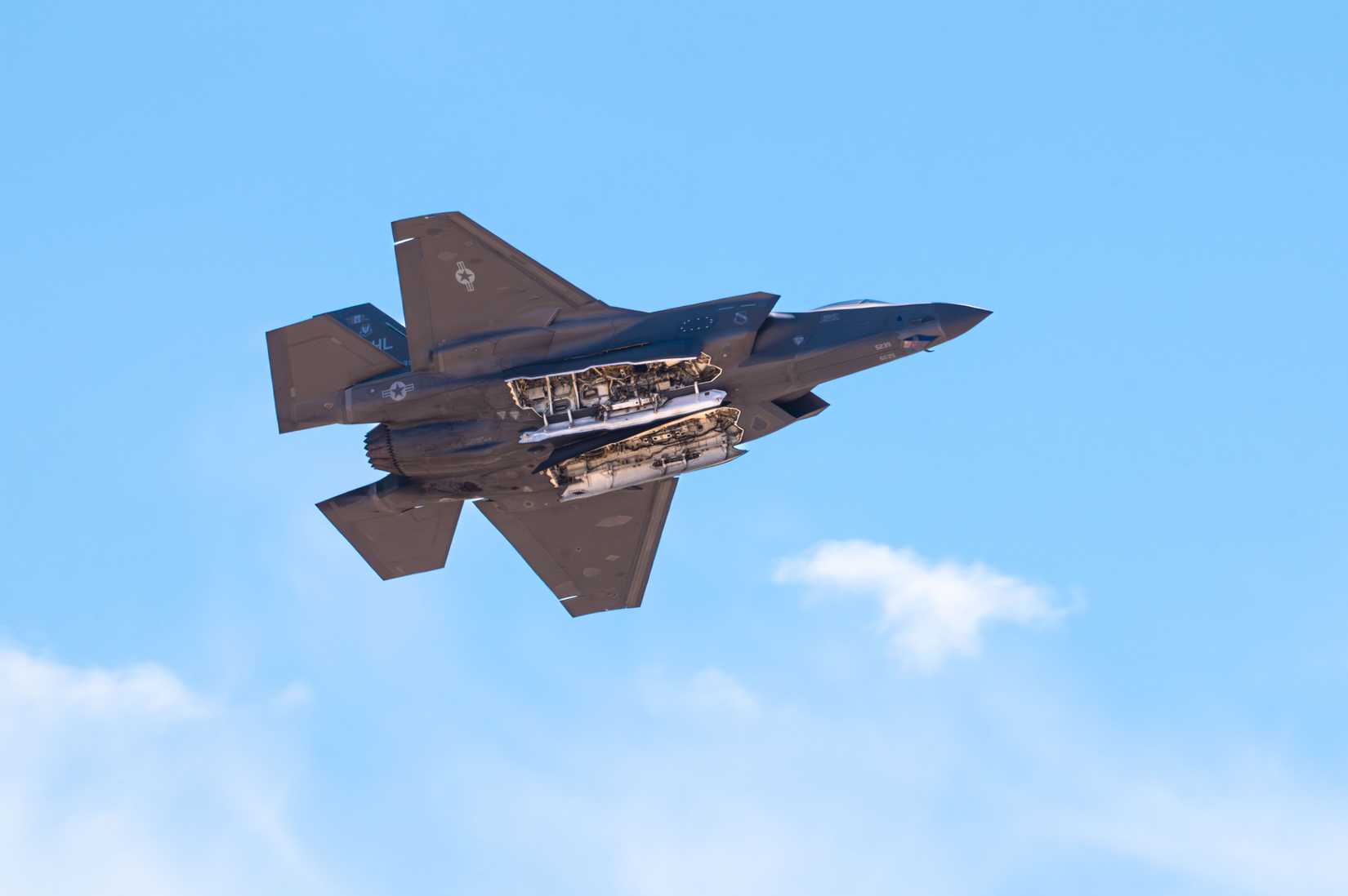 A U.S. Air Force F-35A Lightning II aircraft performs a weapons bay door pass during the Thunder and Lightning Over Arizona Air Show at Davis-Monthan Air Force Base.