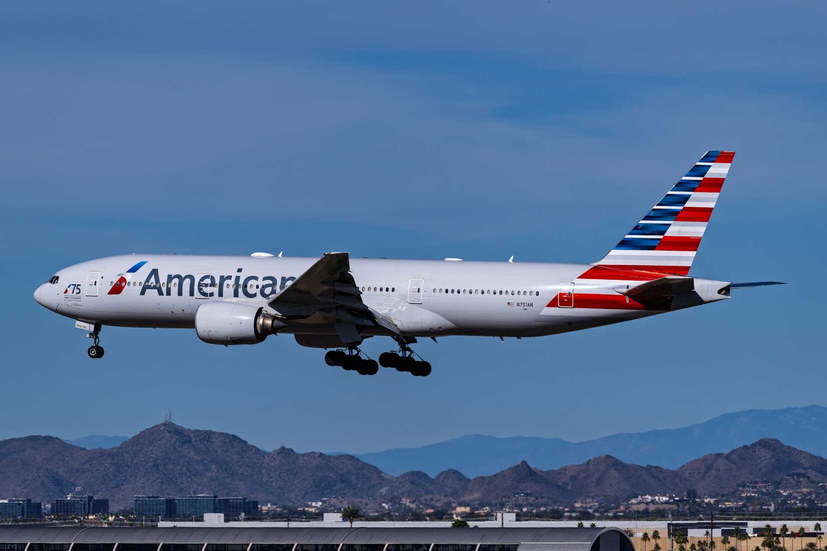 American Airlines Boeing 777-200 N751AN landing on runway 26 at Phoenix Sky Harbor Intl. Airport.